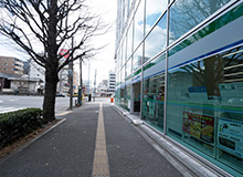 Keep going straight for a while until you see a building with a FamilyMart to your right.